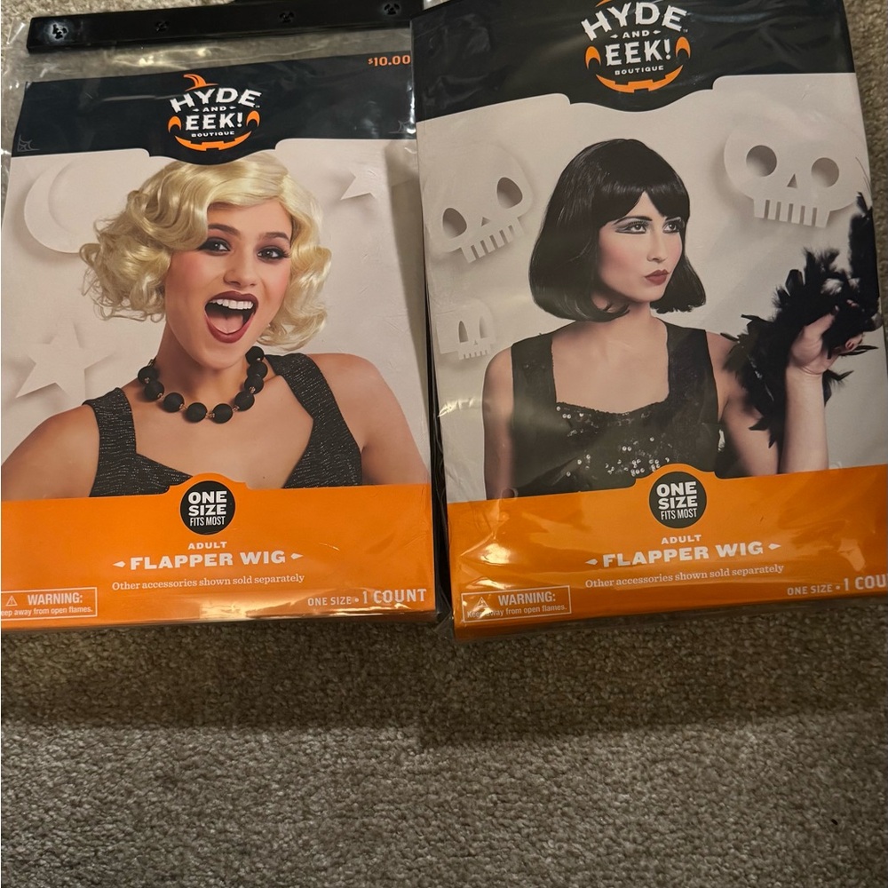 2 new costume wigs. In original packaging. Never worn